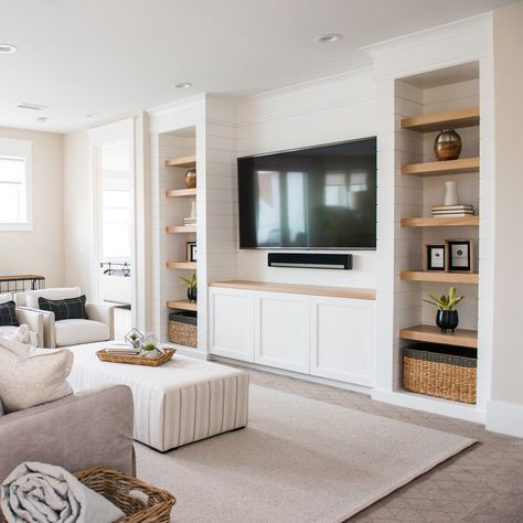 Upper family room where everyone can relax. Notice the shiplap detail how it wraps into the open shelving. Covered Ottoman, Millhaven Homes, Wall Layout, Shiplap Wood, Built In Shelves Living Room, Living Room Built Ins, Shiplap Wall, Loft Space, Storage Idea