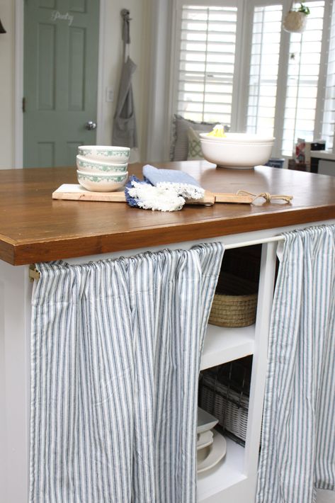 Updating My Kitchen Island with a Curtain | White Cottage Home & Living Kitchen Curtain Cabinet Ideas, Curtain Covered Kitchen Cabinets, Kitchen Under Counter Curtain, Skirted Kitchen Island, Kitchen Cabinet Curtains Diy, Kitchen Curtain Cupboard, Curtain For Cabinet Door, Kitchen Curtain Cabinet, Curtain In Kitchen Cabinets