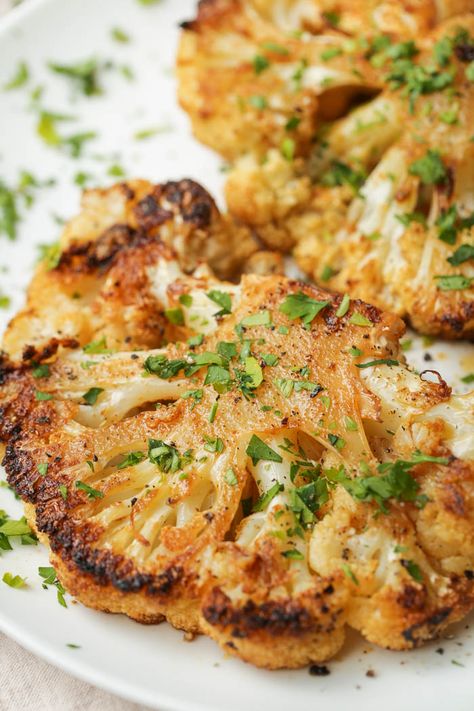 These cauliflower steaks are simply seasoned but absolutely delicious. Tender and packed full of flavor, they are the perfect vegan main course or an easy side dish. #vegan #easy #vegetables #cauliflower Seasoning For Cauliflower, Cauliflower Side Dish Recipes, Cauliflower Steak Recipes, Cauliflower Steaks Roasted, Steaks Recipes, Cauliflower Side Dish, Cauliflower Steaks Recipes, Easy Vegetables, Elimination Diet Recipes