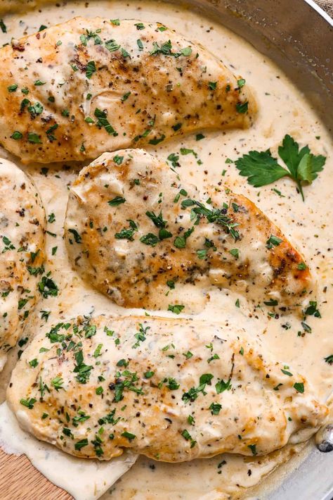 Creamy Boursin Chicken is a rich and decadent one-pan dish that is ready in just about 30 minutes! Pan-fried, seasoned chicken is smothered in a delicious sauce made with cream, parmesan cheese and Boursin cheese. Serve over mashed potatoes for an incredible dinner and major crowd-pleaser! Cheese Sauce For Chicken, Boursin Chicken, Boursin Cheese Recipes, Boursin Recipes, Chicken And Cheese Recipes, Main Entree Recipes, Smothered Chicken Recipes, Over Mashed Potatoes, Creamy Chicken Recipes