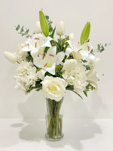 This Large Flovery exclusive all finest artificial flowers design features finest real touch french Hydrangea and white real touch lilies, real touch tulips and real touch large roses in elegant tall glass vase.The arrangement looks elegant and realistic that you cannot tell the different with fresh flower arrangement. This romantic limited edition style can be used for both classic and contemporary luxury home decor, large living room, hotel lobby, restaurant, wedding large main centerpiece or Lily Centerpieces, French Hydrangea, Tall Cylinder Vases, Fresh Flower Arrangement, Large Roses, Tall Glass Vase, Day Lilies, Restaurant Wedding, Fresh Flowers Arrangements