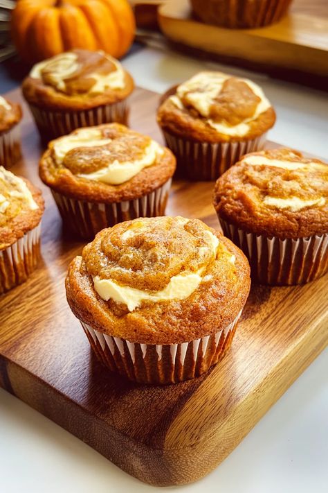 These Pumpkin Cream Cheese Swirl Muffins combine rich pumpkin spice flavor with a creamy cheesecake swirl, creating the perfect autumn treat. Light, fluffy, and irresistibly delicious, they’re a must-bake for the season! Satisfy your cravings – grab the full recipe! #PumpkinMuffins #FallBaking #PumpkinSpice #CreamCheeseSwirl #MuffinRecipe #EasyBaking #FallFlavors #PumpkinDesserts #BakingInspiration #YummyMuffins #FallTreats #DeliciousBakes Cream Cheese Swirl Muffins, Swirl Muffins, Pumpkin Cheesecake Muffins, Cream Cheese Swirl, Pumpkin Spice Cream, Cream Cheese Ball, Pumpkin Cream Cheese Muffins, Pumpkin Muffin Recipes, Pumpkin Cream Cheese