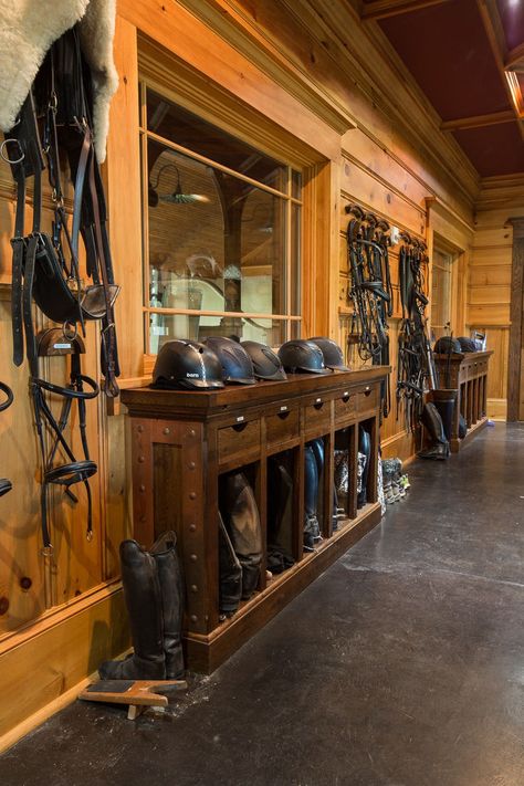 Tack rooms should be both beautiful and functional, so keep these design ideas in mind. Include a large island with baskets, bins, and hooks that make it easy to access your equipment. Incorporate shelves with hooks to store and retrieve boots. And maximize wall space with a variety of cleaning racks for cleaning your saddle and other tack items. Horse Tack Room Ideas, Tack Room Ideas, Shelves With Hooks, Therapy Pools, Horse Tack Rooms, Barn With Living Quarters, Horse Farm Ideas, Tack Rooms, Barn Builders