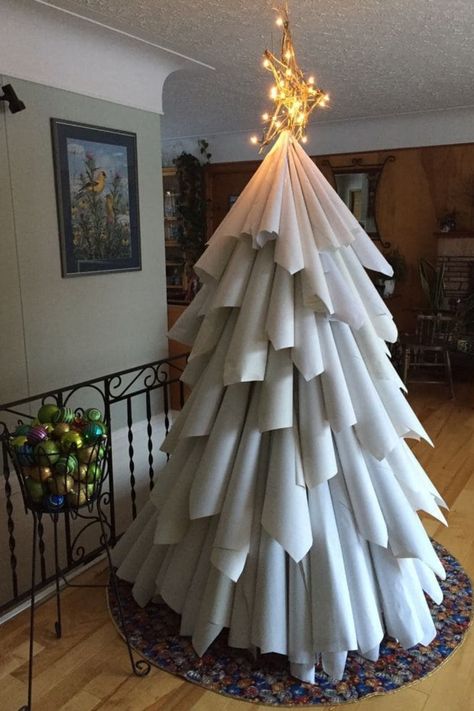 Paper Cone Christmas Tree with Twinkling Lights designed with paper cones and sparkling lights for a creative, DIY touch. Paper Christmas Tree Wall, Diy Christmas Tree Paper, Paper Christmas Tree Diy, Fun Christmas Trees, Alternative Christmas Tree Ideas, Alternative Christmas Trees, Spiral Christmas Tree, Diy Paper Christmas Tree, Hotel Christmas