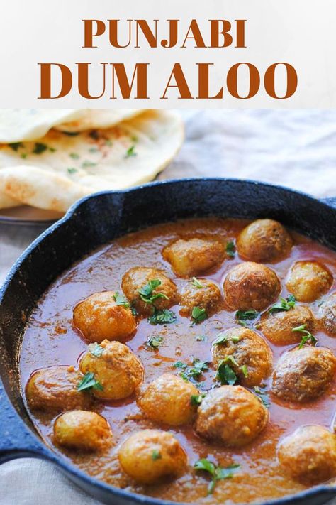 A delicious Punjabi dum aloo recipe with fried baby potatoes simmered in an onion tomato gravy along with cashews, yogurt and spices. Indian curries at their best! Click on the pin to learn how to make this potato delight #punjabidumaloo #dumaloo #vegetarianrecipes #curry #potatorecipes Indian Potato Recipes, Indian Naan, Baby Potato Recipes, Dum Aloo, Paneer Dishes, Aloo Recipes, Indian Dinner, Punjabi Food, Curry Recipes Indian