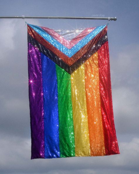 A Rainbow Progress Pride flag made out of sequin fabric sparking in the sunlight in front of a blue sky Pride Progress Flag, Original Pride Flag, Pride Party Aesthetic, Pride Flags Aesthetic, Pastel Pride Flag, Pride Flag Aesthetic, Queer Flag, Pride Photography, Pride History