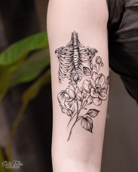 Bones & floral 🌌 ———————————— #goldenirontattoostudio #tattoo #skeletontattoo #inkedgirls #floraltattoo #flowertattoo #torontotattoo… Flowers Growing From Skeleton Tattoo, Rib Cage And Flowers Tattoo, Ribcage With Flowers Tattoo, Bones And Floral Tattoo, Floral Skeleton Tattoos For Women, Half Skeleton Half Flower Tattoo, Anatomical Skeleton Tattoo, Floral Bone Tattoo, Anatomical Ribcage Tattoo