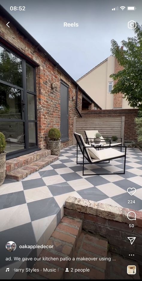 Black And White Porch Tiles, Tudor Backyard Patio, Checkered Tile Outdoor, Checkerboard Patio Floor, Brick And Cement Patio, Diamond Patio Design, Black And White Patio Tiles, Step Down To Patio, Painted Patio Slabs Outdoor Spaces