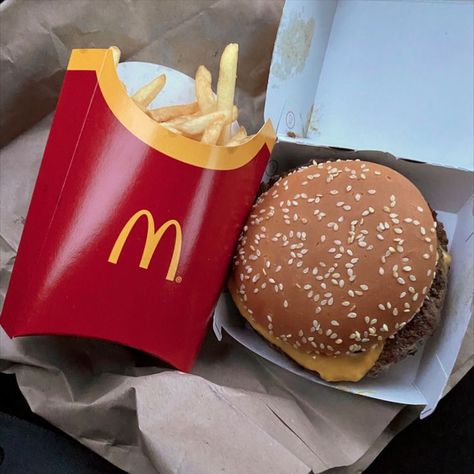 On the left is large mcdonalds fries, in a bright red container with Yellow M symbol. On the right is a Mcdonalds burger, sitting inside it's box, covered in seseme seeds. Mcdonalds Burger, M Symbol, Quarter Pounder, Mcdonalds Fries, Burger And Chips, Burger Box, Burger And Fries, Big Mac, Food Obsession