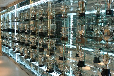 trophy room Trophy Rooms Awards, Trophy Room Ideas Sports, Trophies & Awards Display, Awards Display Wall, Award Room, Real Madrid Trophy Cabinet, Makeup Display Ideas, Awards Display, Real Madrid With Trophy