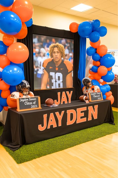 Want to relive your best football moments in style? Picture your senior display table featuring a projector screen that showcases your highlight reel. It’s the perfect way to bring your football achievements to life while keeping your audience entertained. Add some photos and memorabilia to complete the look. Make your senior night unforgettable with this interactive idea! Football Banquet Table Decorations, High School Senior Night Ideas, Senior Night Table Ideas, Senior Table Ideas Sports, Senior Night Table Display, Senior Table Ideas, Sendoff Ideas, College Signing Day, Senior Table