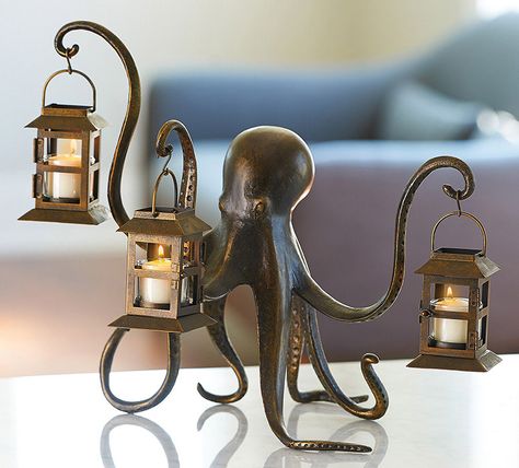 This whimsical eight armed octopus statue uses three of its arms to hold little tea light illuminated lanterns and the other five to keep itself balanced upright. Octopus Lantern, Octopus Decor, Steampunk Octopus, Deco Originale, Decor Guide, Kraken, Nautical Decor, Home Decor Tips, Tea Light Candles