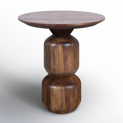 We love having an extra surface to rest drinks and other quick-grab items. Our round end table is a great addition for your living room or den setup. Crafted from solid mango wood, it comes in a warm dark brown tone with a lacquered finish up top that highlights natural grain variation for a hint of rustic charm. The pedestal base shows off a stacked silhouette, bringing a hint of geometry and mid-century modern style to your space. AllModern Rafaella Solid Wood Pedestal End Table in Brown | Siz Mid Century Accent Table, Modern Maximalist Decor, Highlights Natural, Pedestal End Table, Ship Decor, Wood End Table, Round End Table, Wood Accent Table, Brown Tone