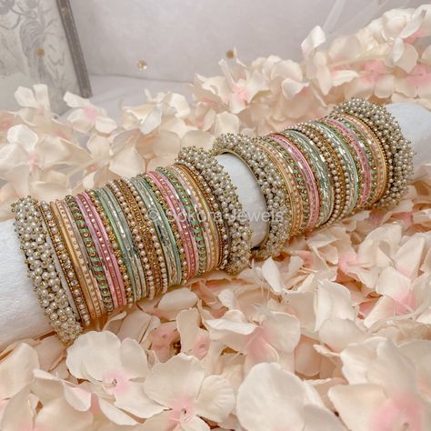 Large stack of antique gold bangles with pretty light Pastel shades of pink, mint and peach finished with sprinkles of crystals and pearls. Ready to Ship Pastel Bridal Jewellery, Pastel Indian Jewellery, Pastel Bangles, Antique Gold Bangles, Desi Jewellery, Fresh Flower Jewelry, Desi Jewelry, Bangle Stack, Pastel Necklace