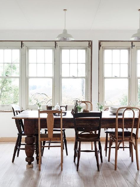 14 Rustic Dining Rooms That Will Make Your Farmhouse Shine Mix Match Chairs, Farm House Dining Room, Mismatched Dining Chairs, Mismatched Chairs, Woven Dining Chairs, Farmhouse Dining Rooms Decor, Kitchen Table Chairs, Rustic Dining Room, Farmhouse Dining Room