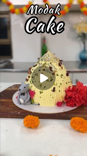 Masterchef Oindrila Bala on Instagram: "This time last year, @sweetboutiquebyaditi and I had so much fun putting together this Jumbo Modak cake for Ganesh Chaturthi 😊  And with the festival almost here again, here’s a little throwback to this Jumbo Modak Cake recipe that perfectly captures the spirit of Ganesh Chaturthi.  The cake is as tasty as it is beautiful ❤️  Give it a try! Here’s how to go about it.  #ganeshchaturthi #modakcake #jumbomodakcake #cakereels #bakingmagic #bakinglove #ganeshfestival #modakrecipe #modaklove #recipereels #cakevideo #indiandelicacy #easymodakrecipes #cakedesigns #uniquecakes #recipeseveryday #cakevideosforbeginners #cakevideosdaily #cakedesigninspirations  [Ganesh chaturthi cake, modak themed cake, modak flavoured cake, jumbo modak cake, Ganesh chaturthi s Modak Recipe, Unique Cakes, Cake Videos, How To Go, Ganesh Chaturthi, The Festival, Themed Cakes, Cake Recipe, Cake Designs