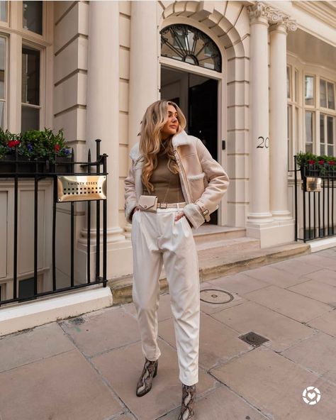 London street style sprint look. White leather trousers with khaki knit top and heeled snake boots 💚 http://liketk.it/3927F @liketoknow.it #liketkit Leather Trousers Outfit Winter, Trousers Outfit Winter, Leather Trousers Outfit, Snake Boots, 2025 Style, Trousers Outfit, Gold Boots, Trouser Outfit, London Street Style