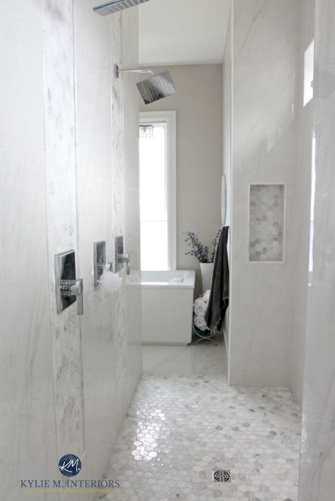 walk-in-shower-in-master-ensuite-bathroom-marble-hexagon-floor-accent-tile-walls-with-double-shower-head-and-rainshower-kylie-m-interiors-decorating-and-design-edecor Master Ensuite Bathroom, Calming Paint Colors, Kylie M Interiors, Ensuite Bathroom Designs, Balboa Mist, Light Grey Paint Colors, Light Paint Colors, Hexagon Tile Floor, White Marble Bathrooms