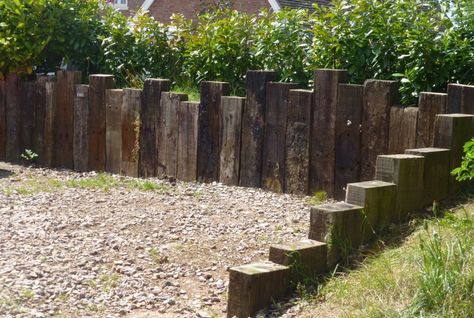 wall from old railway sleepers Railway Sleepers Fence Ideas, Railway Sleeper Driveway, Sleeper Fence Ideas, Railway Sleepers Fence, Railway Sleeper Fence, Railway Sleepers Ideas, Railway Sleepers Garden Ideas, Sleeper Fence, Railway Sleepers Garden