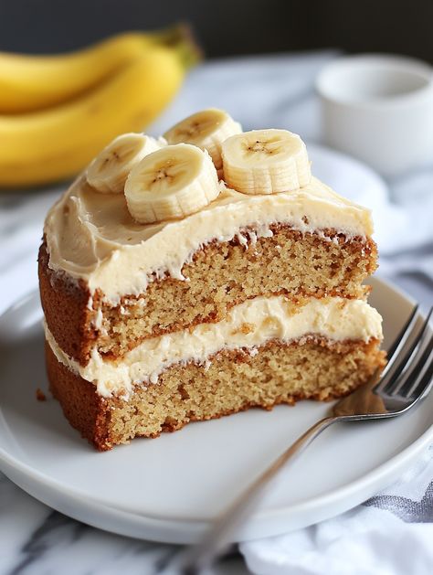 Ingredients:  2 cups flour 1 tsp baking powder ½ tsp salt ½ cup butter 1 cup sugar 2 eggs 1 cup mashed ripe bananas Cream cheese frosting  Instructions:  Mix dry ingredients, then cream butter and sugar. Beat in eggs and mashed bananas.  Combine with dry ingredients and bake at 350°F (175°C) for 30 minutes.  Frost with cream cheese frosting and cut a slice for a rich, banana-filled cake. Banana Filling For Cake, Cake Mix Recipes Homemade, Homemade Snacks Recipes, Cream Butter, Cooking Homemade, Cake Fillings, Ripe Bananas, With Cream Cheese Frosting, Coffee Dessert