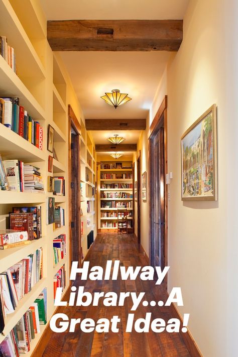 A hallway is a great place to create a library. The built in shelving and textural beams as well as ambient lighting create a rustic atmosphere. #homelibrary #hallwaylibrary #hallwaydesignideas Hall Library Bookshelves, Hallway High Shelf, Library Hallway Bookshelves, Hallway With Bookshelves, Hallway Library Ideas Narrow, Built In Bookshelf Hallway, End Of Hallway Bookcase, Hallway Bookcase Ideas, Built In Shelves Hallway