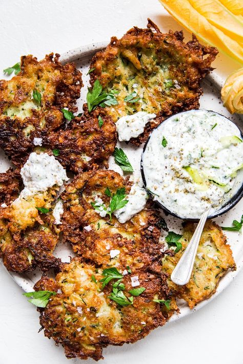 Move over zucchini bread—our savory, Italian-ish (hello salty-licious parmesan cheese!), Greek-ish (hello tzatziki sauce for dipping!) crispy zucchini fritter recipe is here to steal your thunder. Greek Zucchini Fritters, Keto Zucchini Fritters, Crispy Zucchini, Zucchini Fritters Recipe, The Modern Proper, Modern Proper, Zucchini Fritters, Zucchini Bread Recipes, Fritter Recipes