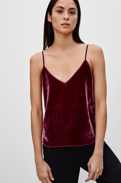 10 Going-Out Tops You Can Wear With More Than Jeans #refinery29  http://www.refinery29.com/2016/01/102209/going-out-tops-alexa-chung#slide-1  Just because the holiday season is over doesn't mean it's time to pack up the red velvet entirely. This spaghetti-strapped tank is super simple, meaning its versatility is off the charts. How good would this look under a borrowed-from-the-boys blazer? Or a leopard faux-fur jacket?Talula Arcade Camisole, $60 $19.99, available at <a href="http://us.aritz... Dress Up Wardrobe, Red Velvet Top, Blazer For Boys, Velvet Tank Top, Velvet Tank, Women's Blouses, Velvet Top, Going Out Tops, Velvet Tops