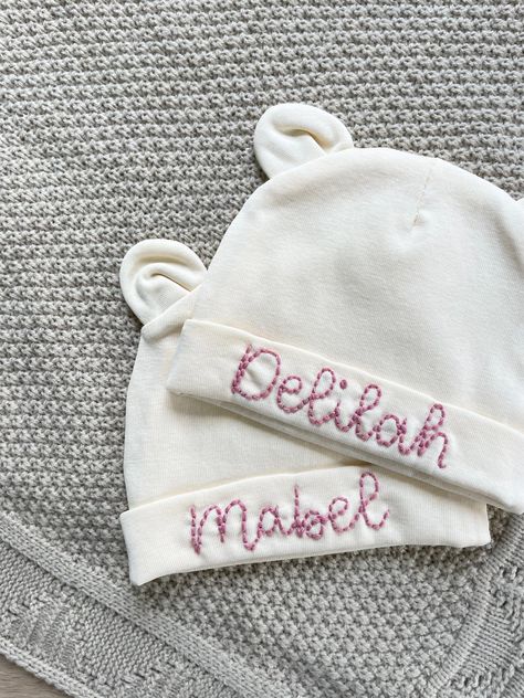 Custom personalised newborn baby & children's name/birth announcement hat hand-embroidered with name. Can be customised with any text in any colour.  Please not that this listing is for the hat with TWO NAMES (one on either side) only. Please see my other listings for the single-sided hat. A range of colours available. Please see photos for availability. In the 'PERSONALISATION' section, please write the text you would like stitched and the colour you would like it in. Turnaround time is current Baby Hat Embroidery, Teddy Bear Hat, Name Announcement, Baby Teddy Bear, Monogram Hats, Baby Teddy, Personalized Newborn, Name Embroidery, Hat Custom