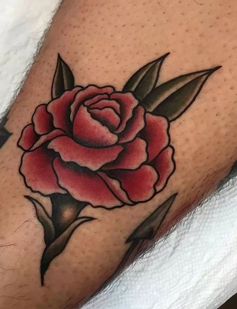 The Meanings Of Carnation Tattoos (Explained In Detail) Old School Tattoo Rose, Istanbul Tattoo, Carnation Tattoo, Inner Arm Tattoos, Traditional Tattoo Flowers, Rose Tattoos For Men, Traditional Style Tattoo, Red Rose Tattoo, Omerta Tattoo