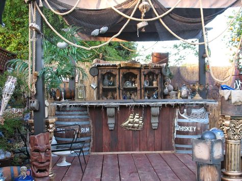 Belly up to the pirate bar! Pirate Garden, Tiki Bars Backyard, Goonies Party, Pirate Decorations, Pirate Bar, Porch Grill, Halloween Pirates, Pirate Ideas, Outdoor Tiki Bar