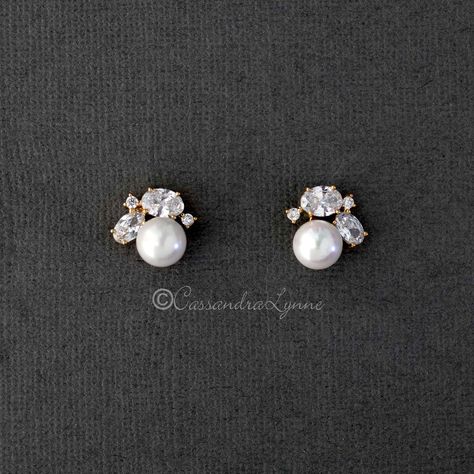 A classy little stud earrings designed with ivory glass pearls and topped with oval and tiny round cubic zirconia stones. A great style for any evening out! They are .5 inches long with post pierced backs. Rhodium or gold plated, AAA grade CZ, lead and nickel free. Bridesmaid Stud Earrings, Pearl Bridesmaid Earrings, Tiny Jewelry, Pearl Cluster Earrings, Silver Crystal Earrings, Bridesmaids Earrings, Blue Crystal Earrings, Heirlooms Jewelry, Pearl And Diamond Earrings