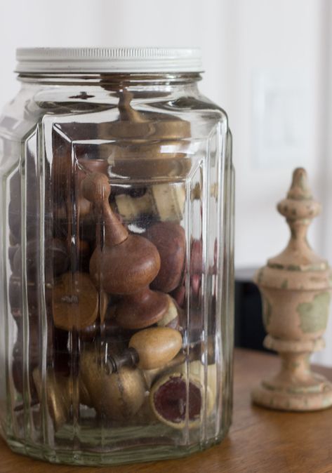 collection-of-finials in jar Bright Basement, Sectional Sofa Comfy, Glassware Display, Display Collections, Gift From The Sea, Comfy Sectional, Patterned Ottoman, Anne Morrow Lindbergh, Vase With Branches