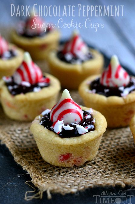 Dark Chocolate Peppermint Sugar Cookie Cups. These cookie cups are filled with decadent chocolate ganache and topped with Candy Cane Hershey's Kisses. Sugar Cookie Cups, Peppermint Recipes, Mom On Timeout, Peppermint Sugar Cookies, Delicious Christmas Cookies, Peppermint Sugar, Hershey's Kisses, Cookie Cups, S'mores