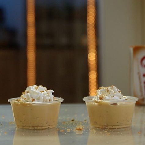 BUTTERFINGER PUDDING SHOTS 1 oz. (30ml) Chocolate Vodka 2 oz. (60ml) Butterscotch Schnapps 3 oz. (90ml) Milk 1/2 Packet Butterscotch Pudding 1/2 Tub Whipped Topping Crushed Butterfinger Garnish: Whipped Cream/Crushed Butterfinger PREPARATION 1. Add pudding mix, milk, vodka and butterscotch schnapps to small bowl and whisk to combine. 2. Fold in cool whip and crushed butterfinger, combine and spoon into small cups. 3. Place in fridge to set. Before serving add whipped cream an... Scottish Puddings, Pudding Shot Recipes, Jungle Juice Recipe, Infused Treats, Chocolate Vodka, Shooter Recipes, Dessert Shooters, Candy Cocktails, Pudding Shots