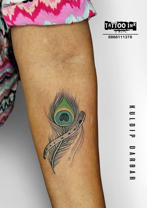 #peacockfeathertattoo #feathertattoo #tattooforgirl #krishnatattoo #tattoos #tattoo #tattoodesign #feathertattoodesign #bestpeacockfeathertattoo Basuri Krishna Flute Tattoo, Basuri Krishna Flute, Feather With Flute Tattoo, Krishna Flute Tattoo, Peacock Feather With Flute, Radha Krishna Tattoo, Flute Tattoo, Feather Tattoo Wrist, Krishna Tattoo