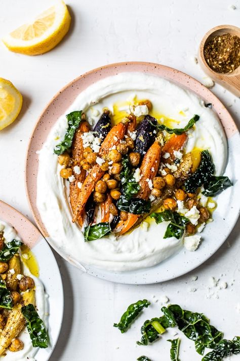 Roasted Carrots and Chickpeas seasoned with za’atar and served over Greek yogurt with lemony kale makes a wonderful side dish or meatless main! #plantbased #yogurtbowls #vegetarian #carrots #chickpeas Roasted Carrots And Chickpeas, Carrots And Chickpeas, Roasted Rainbow Carrots, Yogurt Bowls, Roasted Carrot, Za Atar, Yogurt Bowl, Carrot Recipes, Skinny Taste Recipes