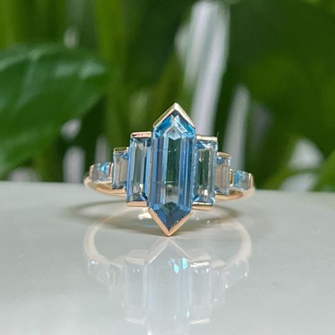 Description: -vintage engagement ring -comfortable band Shown:Solid  14K  Rose Gold (Please comfirm your US size when you make an order) Main stone:4.5*13mm Hexagon shaped London blue topaz Side stone:0.81ct London blue topaz Total weight:2.5g Shank width:1.6mm Shank thickness:1.2mm Wedding band:0.11ct London blue topaz Metal:18K or 14K solid gold Available in yellow white or rose solid 14 or 18k gold ADDITIONAL SERVICE: 1.Rush Order 2.Engraving Service  3.Payment Plan 4.One-year Free Warranty London Blue Topaz Engagement Ring, Engagement Ring Cluster, London Blue Topaz Engagement Rings, Baguette Engagement Ring, Blue Topaz Engagement Ring, Ring Rosegold, Ring Cluster, Blue Gemstone Rings, Engagement Ring Rose Gold