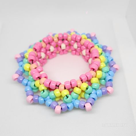 This gorgeous, one of a kind kandi mandala cuff will be the envy of all your friends! With its pastel-hued perfection, your look will be truly out of this world! 🌈 *Length is 30 pony beads or 10.6 in around Kandi Bracelets Ideas Cuffs, Kandi Inspo Single, Pastel Kandi, Kandi Ideas Cuffs, Kandi Inspo Cuff, 3d Kandi, Fnaf Kandi Cuff, Kandi Beads, Kandi X Base Cuff