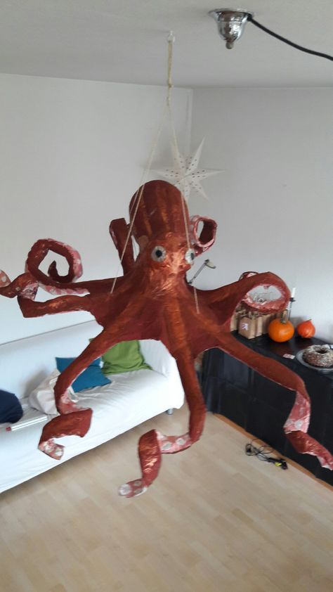 Paper mache octopus piñata Paper Octopus, Octopus Pinata, Diy Octopus Decoration, Paper Mache Octopus, Monster Pinata, Coral Party, Finding Dory Party, Dory Party, Pool Party Food