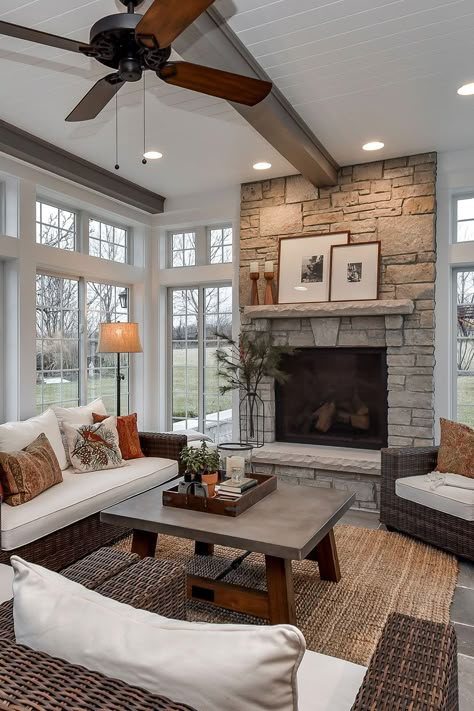 Use Of Stone Fireplace In Beige Tones In The Sunroom Area 4 Season Sunroom Ideas With Fireplace, Four Season Sunroom With Fireplace, Three Season Porch With Fireplace, 4 Seasons Room With Fireplace, Three Season Room With Fireplace, 3 Season Porch With Fireplace, 3 Season Room With Fireplace, Conservatory Family Room, 3 Season Room Furniture