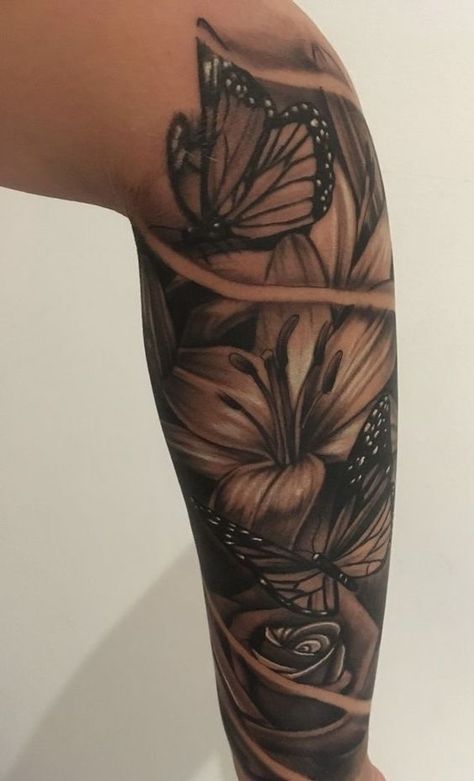 Floral Tattoo Design Black Women, Garden Tattoos For Black Women, Female Tattoo Sleeve Black Women, Lily Half Sleeve Tattoo For Women, Shoulder Half Sleeve Tattoo For Women Black, Tattoo Cover Up Ideas For Black Women, Sleeve On Black Women, Flower Sleeve Tattoos For Women Black, Coverup Tattoo Ideas For Women Cover Up Arm