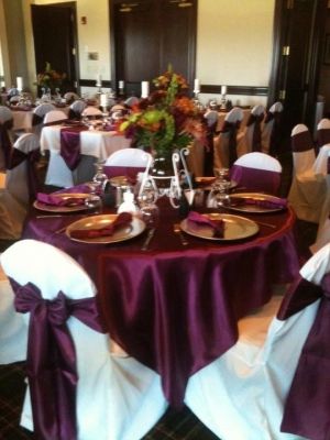 Satin wine overlays and sashes , white chair covers and tablecloths. www.cvlinens.com #wedding #event #tablescape http://ruffledblog.com/recycle-your-wedding/see-ads/2522/120-Silver-charger-plates/Charger-Plates/ Silver Charger Plates, White Chair Covers, Jade Wedding, Purple Bouquets, Ideas For Wedding Decorations, Jewel Tone Wedding, Wedding Gifts For Groomsmen, Rustic Wedding Flowers, Classic Brides