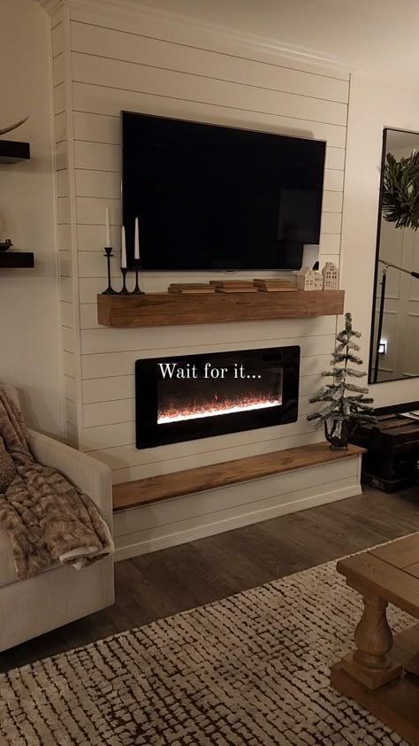 Cozy vibes and secret storage! ✨️ Our electric fireplace isn't just for warmth—it's a stylish centerpiece with a sneaky surprise. Stay… | Instagram Living Room With Fireplace And Tv Stand, Faux Fireplace With Floating Shelves, Small Faux Fireplace Ideas, Wall Decor Around Mounted Tv Over Fireplace, Electric Fireplace Ideas No Tv, Recessed Tv Mount Over Fireplace, Box Around Tv On Wall, Electric Farmhouse Fireplace, Tv In Fireplace Ideas