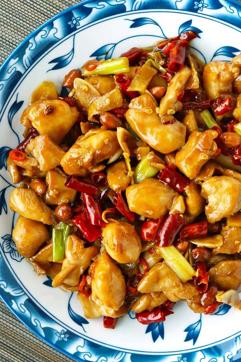 Kung Pao Chicken is a popular Sichuan chicken stir-fry that’s quick and easy to make on any given weeknight and full of irresistible savory, spicy, numbing flavors with a hint of tang and crunchy peanuts. Learn how to make it at home the authentic Chengdu-style way! #kungpaochicken #gongbaojiding #sichuan #spicy #stirfry #dinner #chicken #quickandeasy #asianfood #chinese food #authenticrecipe | That Spicy Chick Authentic Kung Pao Chicken Recipe, Sichuan Chicken, Asian Stir Fry Recipe, Szechuan Recipes, Kung Pao Chicken Recipe, Cut Recipe, Asian Stir Fry, Healthy Party Food, Chinese Cooking Wine