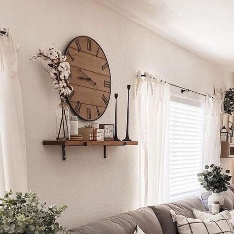 Farmhouse Is My Style on Instagram: "The heart of farmhouse charm 🌾🏡 is perfectly captured in this cozy living space! The neutral tones create a soothing atmosphere, while the mix of textures adds a touch of rustic elegance. The large clock 🕰️ and the delicate greenery 🌿 bring a fresh, inviting vibe. This is the ideal spot to relax and unwind after a long day. (Photo Credit: @amadadecor)

#FarmhouseStyle #CozyLiving #RusticCharm #NeutralDecor #HomeSweetHome" Clock Above Tv, Big Wall Clock Decor Ideas, Clock Wall Decor Layout, Large Wall Clock Decor Ideas, Big Wall Clocks Living Rooms, Large Clock Decor, Wall Clock Decor Ideas, Large Wall Clock Decor, Clock Decor Ideas