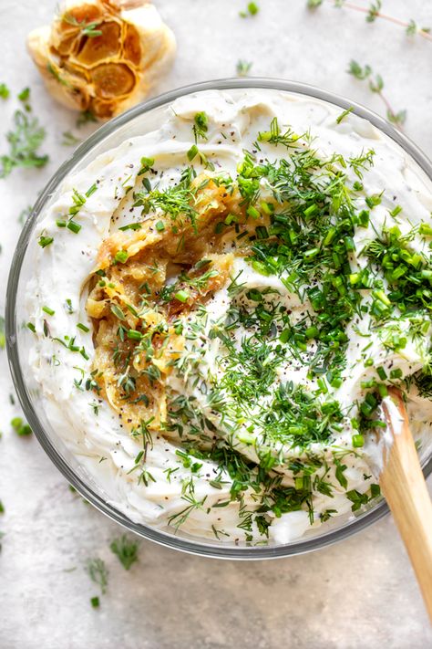 This garlic and herb cheese spread made with a touch of goat cheese is loaded with roasted garlic and a savory trio of fresh herbs! | thecozyapron.com #garlicandherbcheesespread #garlicandherbcheesespreadrecipes #garlicherbcreamcheesespread #garlicherbcheesespreadrecipe #garlicandherbspreadablecheese #garlicherbcheesespread #garlicherbspreadablecheese #cheesespread #cheesespreadrecipes #cheesespreadrecipesforcrackers #cheesespreadsforcrackers Roasted Garlic Cheese Dip, Herb And Garlic Cream Cheese Recipe, Garlic And Herb Goat Cheese Recipes, Garlic Herb Cream Cheese, Herb Cream Cheese Dip, Garlic Herb Cheese Spread Recipe, Cheese Spread Recipes, Whipped Goat Cheese, Herb Cheese