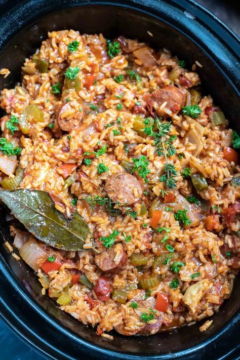 Celebrate Mardi Gras with this Chicken and Sausage Slow Cooker Jambalaya Recipe. A Cajun favorite made super easy right in your crockpot. A fun, flavorful and festive dinner idea. #slowcookerrecipes #crockpotrecipes #mardigrasrecipes #jambalayarecipes #jambalaya #cajunrecipes #slowcookerjambalaya #chickenricerecipes #easydinnerrecipes Jambalaya Slow Cooker, Brown Rice Jambalaya, Jambalaya Recipe Slow Cooker, Jambalaya Recipe Crockpot, Chicken Jambalaya Recipe, Sausage Slow Cooker, Chicken Jambalaya, Slow Cooker Jambalaya, Chicken And Sausage Jambalaya