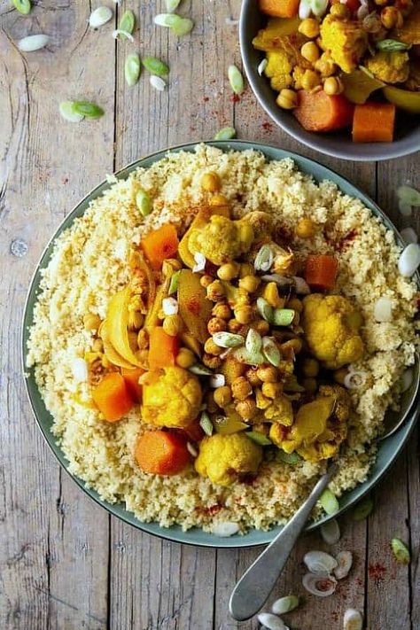 Make this North African food recipe in the Slow Cooker for a healthy, beautiful and rich tasting meal. Carrots, Cauliflower, protein-rich chickpeas, spices and more go in the crockpot and at dinner, serve over simple flavor infused couscous. #couscous #slowcooker #crockpot #veganrecipes #vegan #maindish Slowcooker Vegetables, African Buffet, Crockpot Vegan, North African Food, Plating Food, Presentation Food, Vegan Crockpot Recipes, Couscous Recipe, Vegan Crockpot