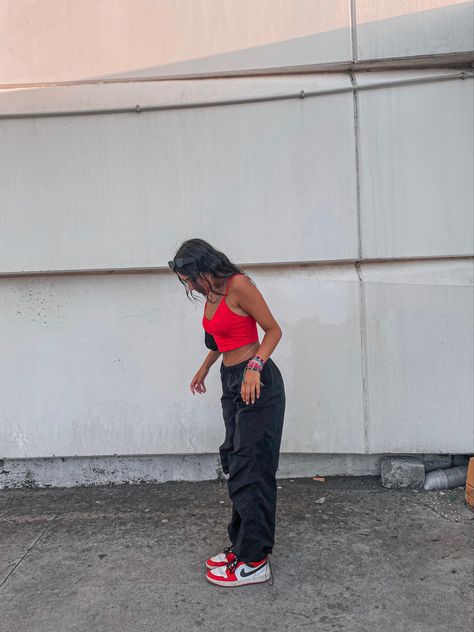 Concert Outfits Summer Hip Hop, Black And Red Shoes Outfit, Red And Black Outfits For Concert, Red And Black Air Jordan 1 Outfit, Red And Black Hip Hop Dance Outfits, Red Air Jordans Outfit, Red And Black Streetwear Outfit, Red Concert Outfit Ideas, Red Top Black Pants Outfit