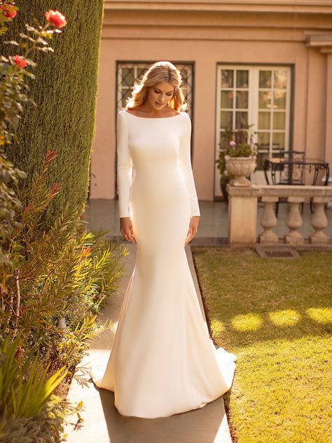 An exquisite dress from top to bottom, style J6791 from Moonlight Bridal will work wonders for a bride that wants that hour glass shape. Long crepe-back satin sleeves hug your arms while the sabrina neckline is high-fashion and elegant. This style gown is perfect for a bride that wants a little regal, but also vintage details.  #longsleeveweddingdress #mermaidweddingdress #sexyweddingdress #vintageweddingdress Bridal Gown Simple, Gown Simple, Moonlight Bridal, Wedding Dress Store, White Long Sleeves, Welcome To Our Wedding, Dress Store, Simple White, Bridal Gown